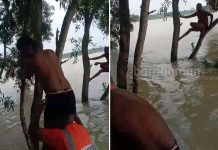 মাছ ধরার নৌকা বাঁচাতে গিয়ে জলের তোড়ে ভেসে গাছে আশ্রয়